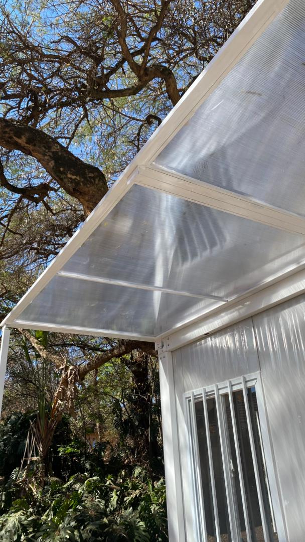 Clear polycarbonate canopy on a white frame
